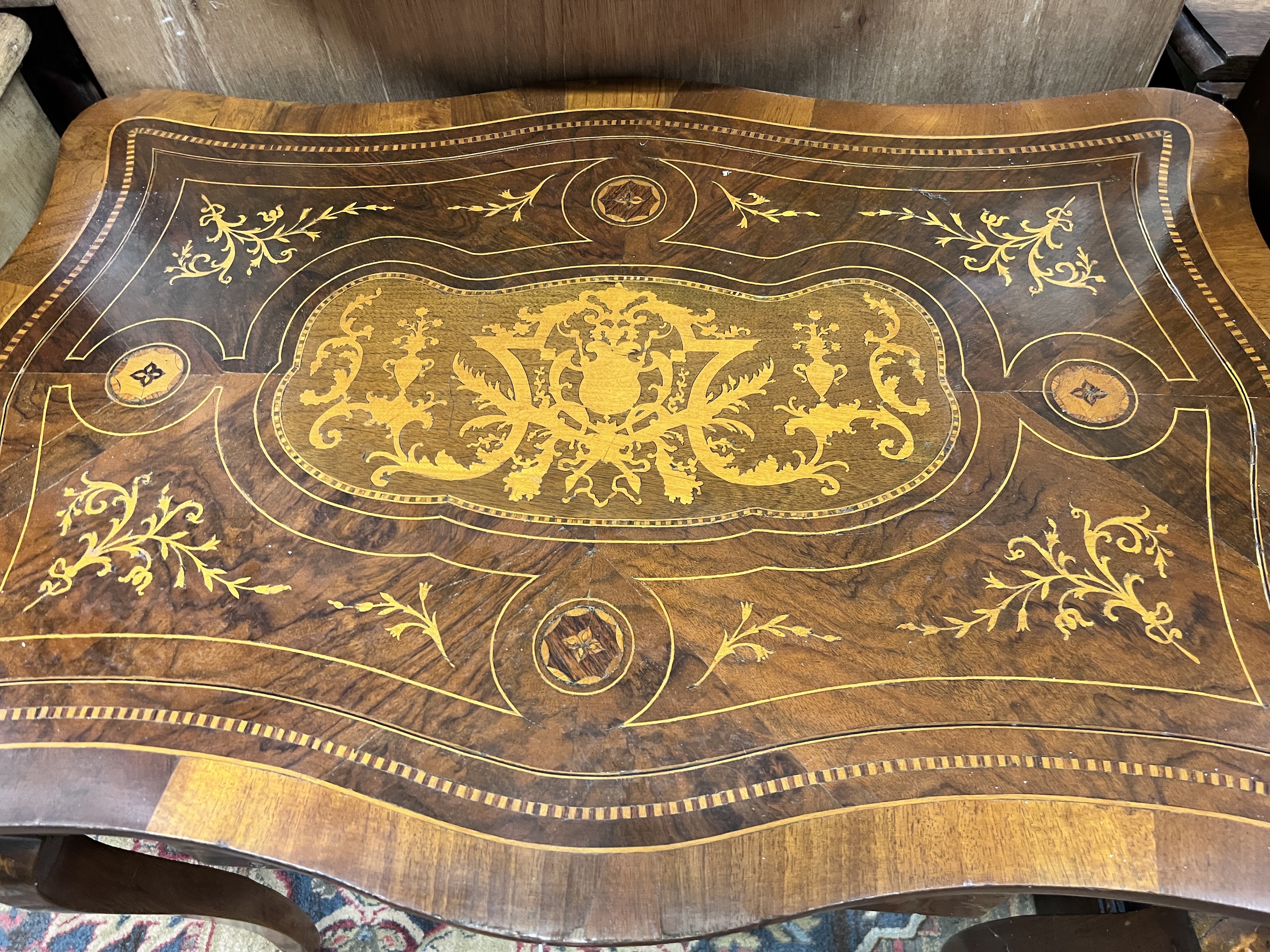 A 19th century Continental marquetry inlaid walnut occasional table, width 89cm